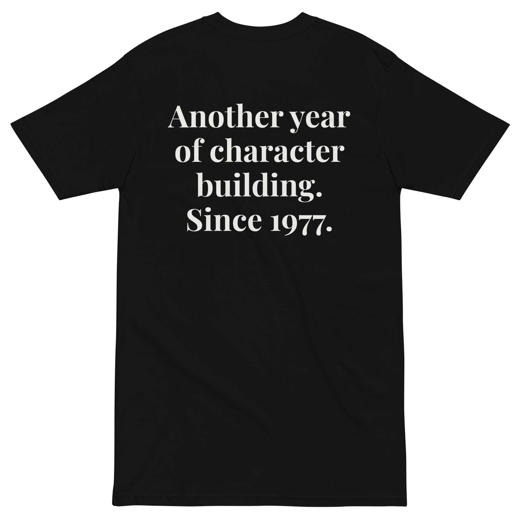 Back flat lay of the Another Year of Character Building Since 1977 heavyweight tee.