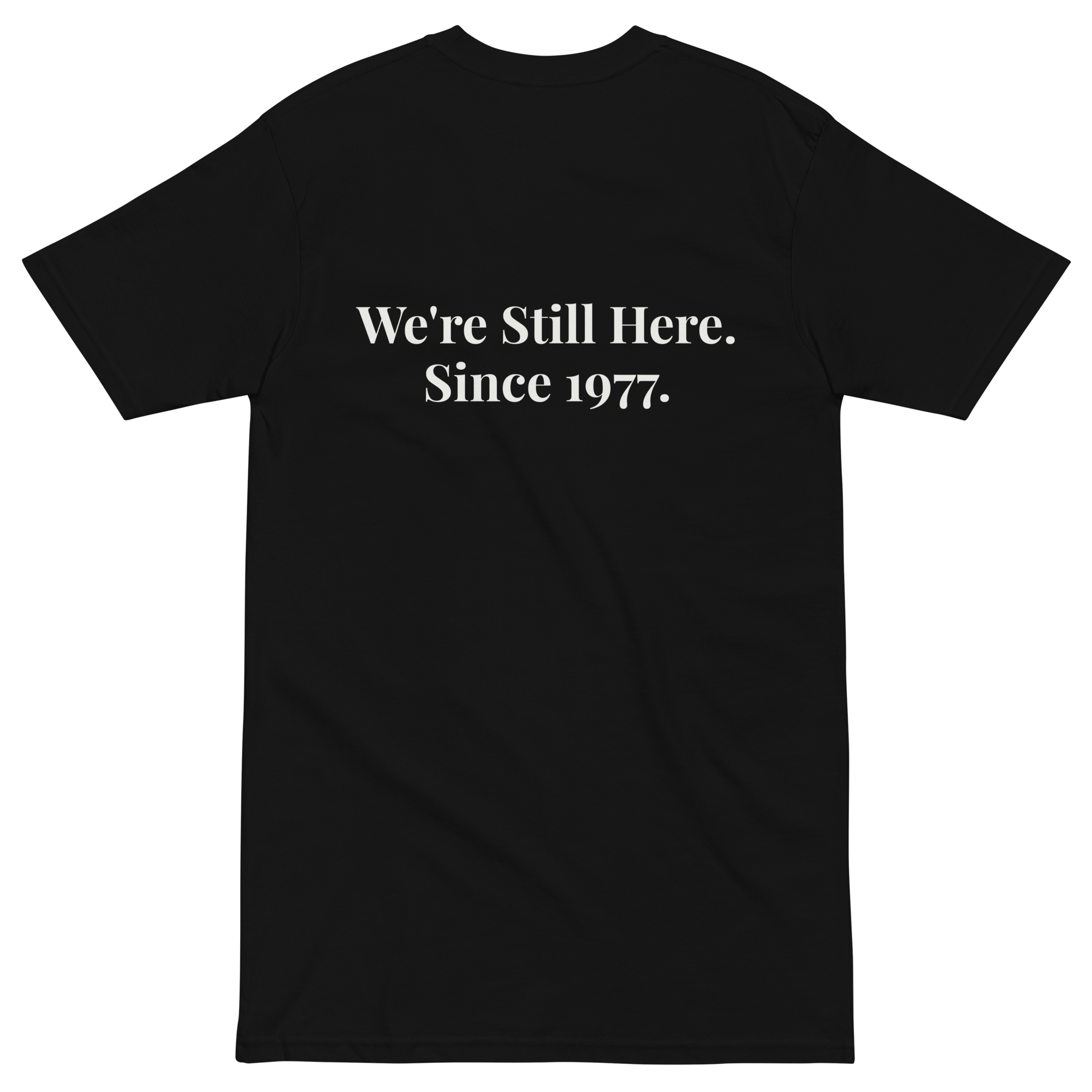 Back flat lay of the We're Still Here Since 1977 heavyweight tee.